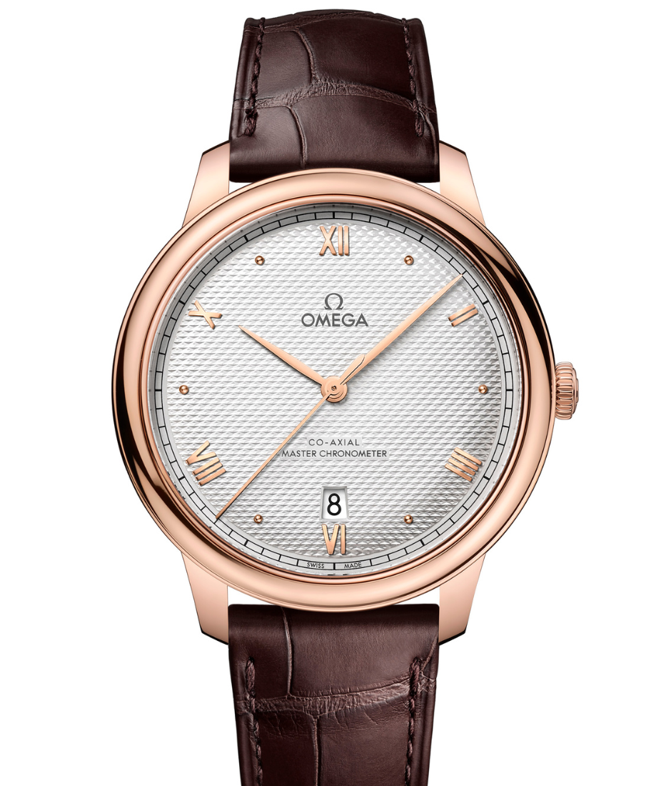 Jonathan Bailey chose to wear a 40 mm De Ville Prestige in 18K Sedna™ Gold on a brown leather strap OMEGA timepiece