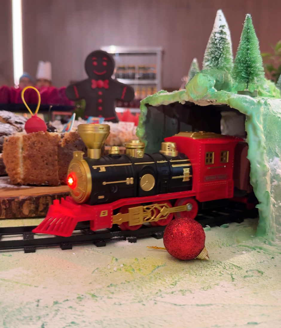 choo-choo train chugging along the dessert station at Santa's Magical Village